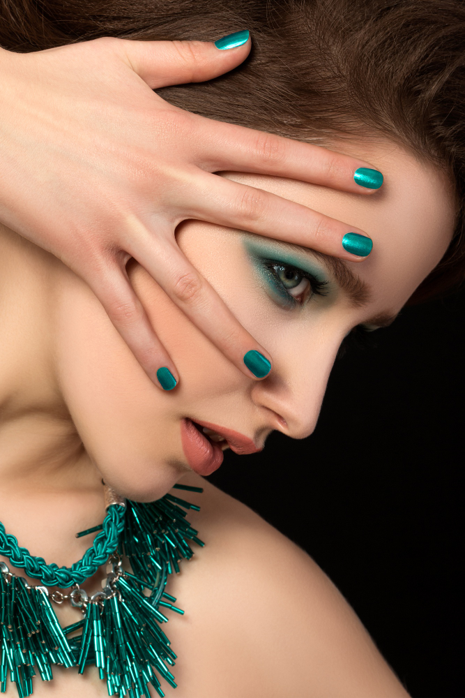 portrait-gorgeous-young-woman-with-blue-nails-eye-makeup-black